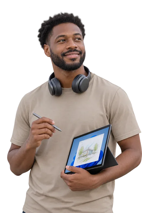 A bearded man with headphones round his neck holds a Windows tablet and a pen.